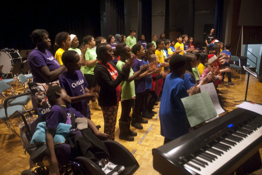 A group of children singing in a choir