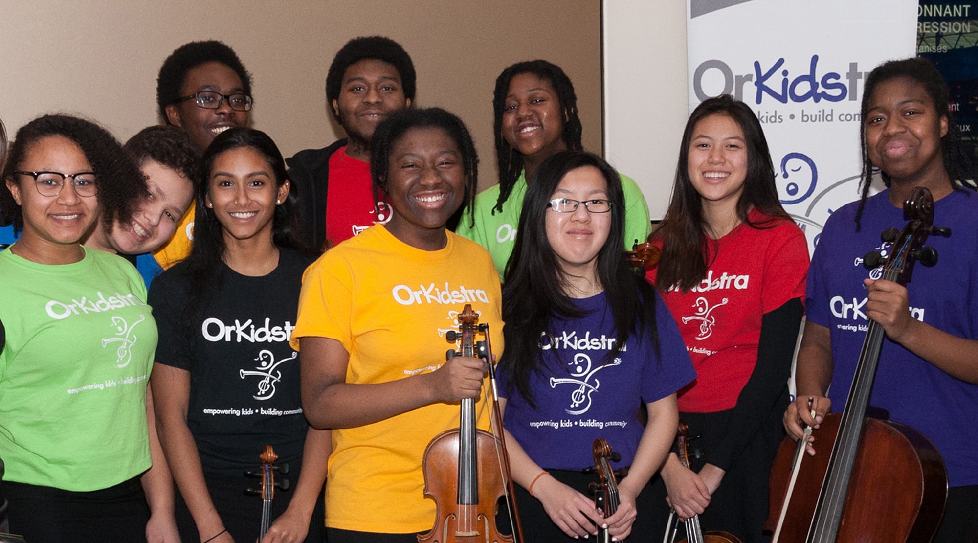OrKidstra students smiling with instruments